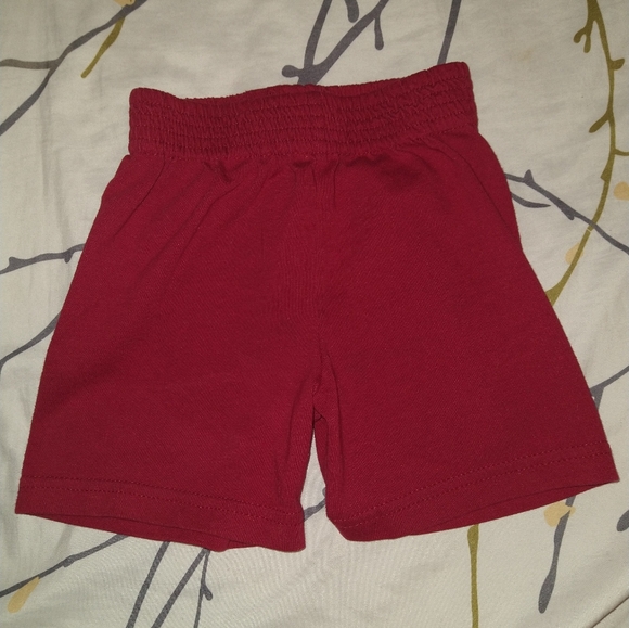 I am selling a pair of red shorts. Size- 18 months. - Picture 1 of 2